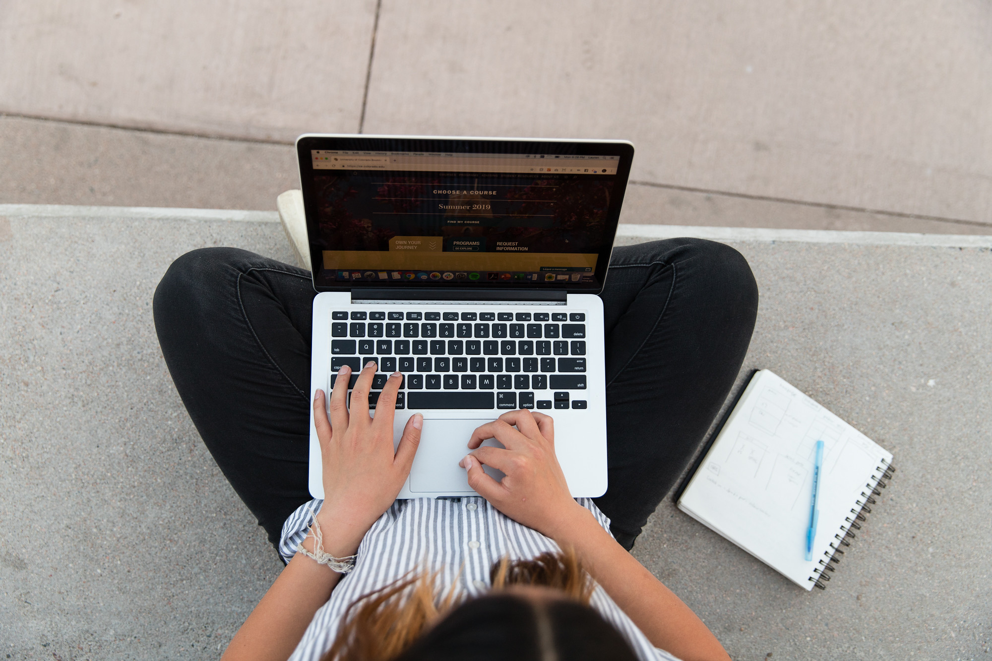 person typing on laptop