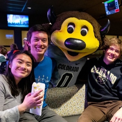 students and Chip the buffalo mascot at The Connection