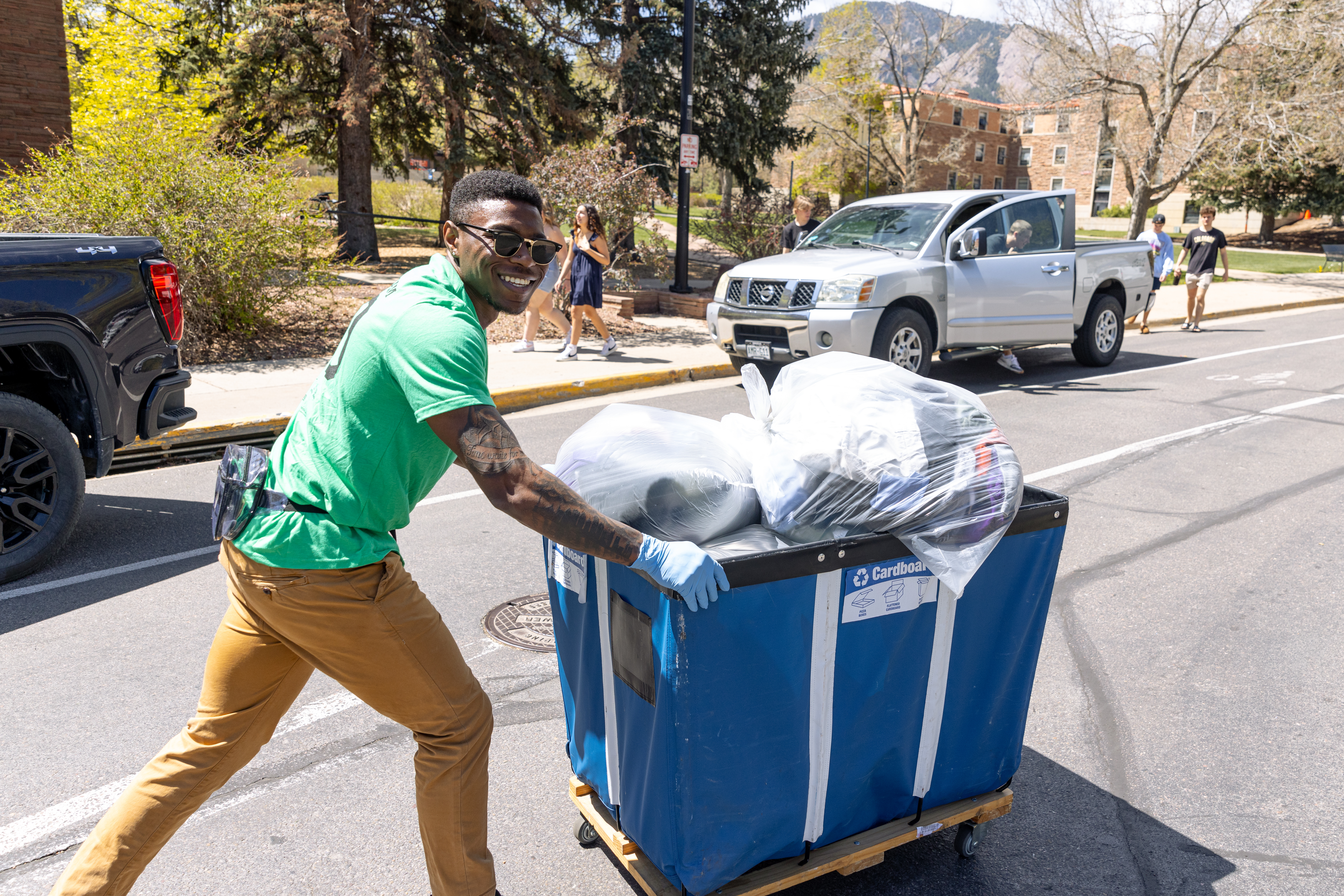 Student pushing a cart during move-out