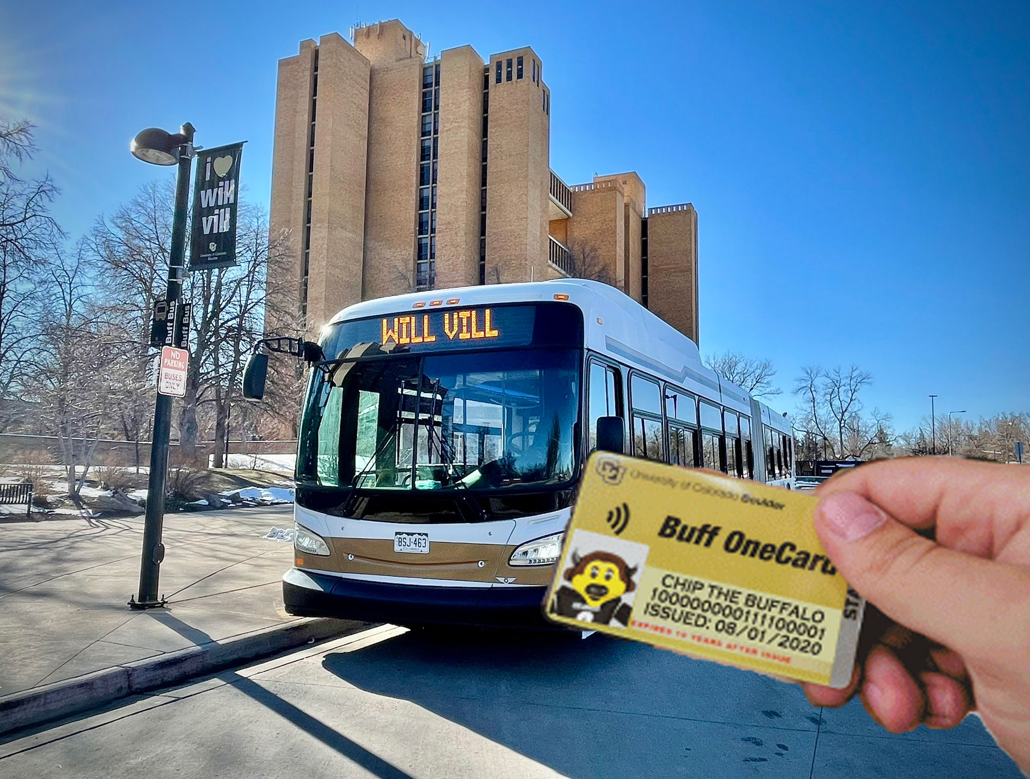 Buff OneCard being held up in front of a bus
