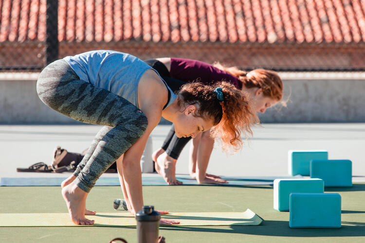 student doing yoga in an outdoor class