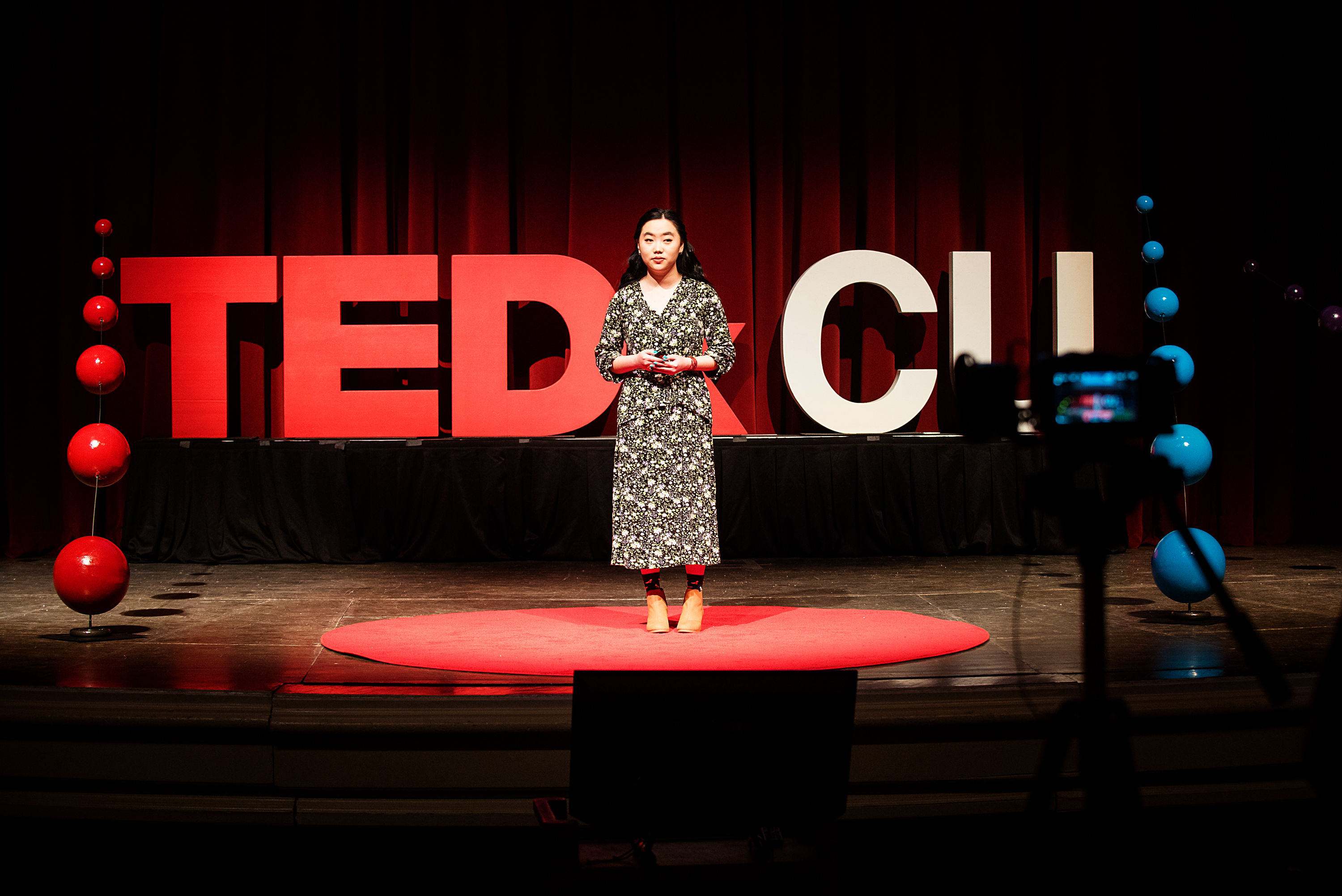 student speaking at TEDxCU event