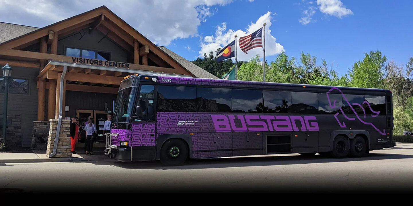 Bustang bus in front of a visitors center.