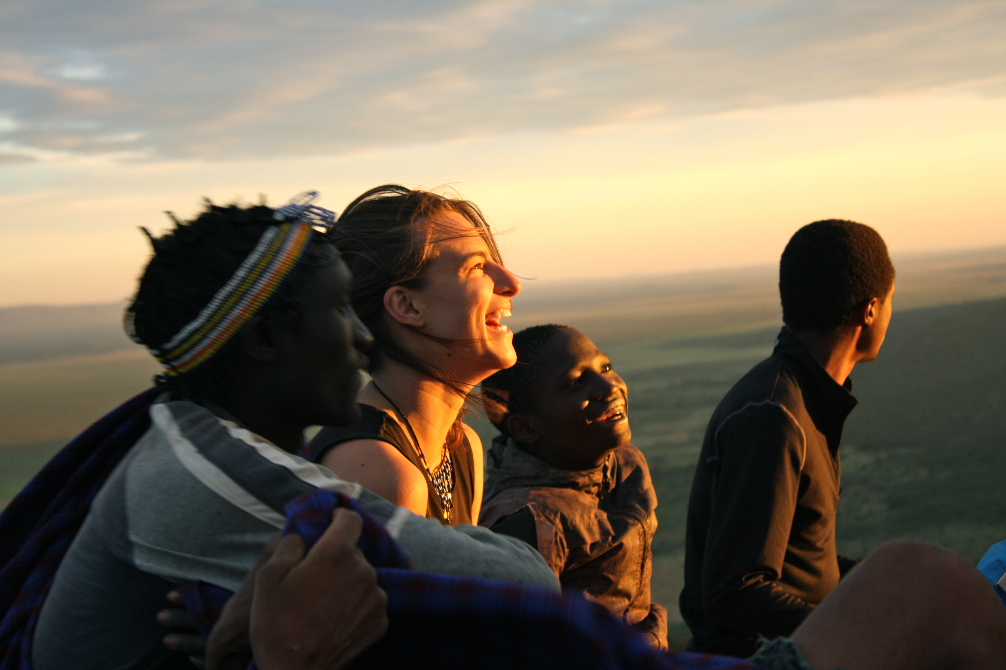 Students and locals watching sunset in Tanzania